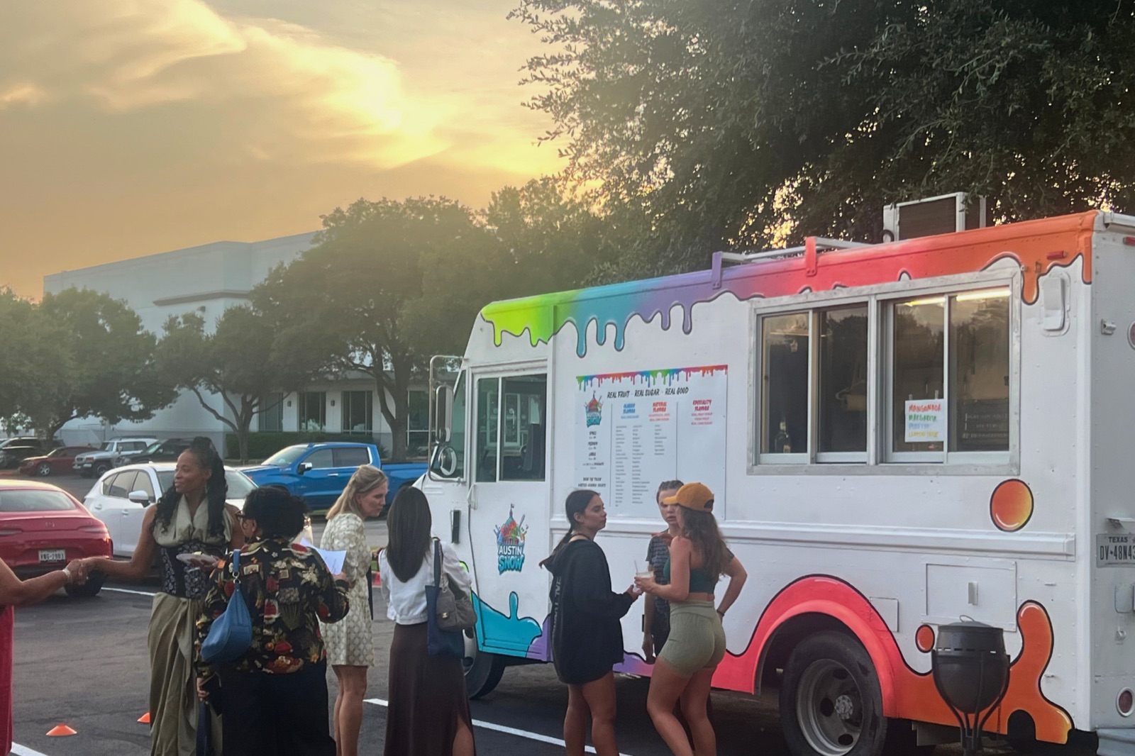 Kids getting shaved ice served at the Austin Snow truck window